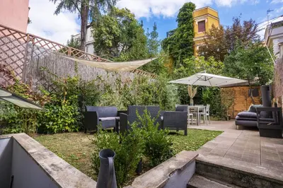 a patio with a hammock in a garden at Residenza Caprera in Rome