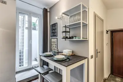 a kitchen with a counter and a window at Residenza Caprera in Rome