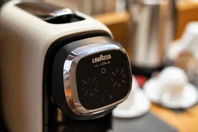a close up of a toaster on a kitchen counter at Royal Rooms Corso in Rome