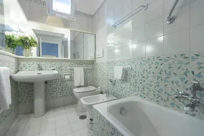 a bathroom with a sink and a toilet and a tub at Amazing Campo de' Fiori in Rome