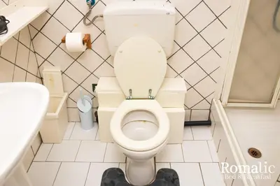 a small bathroom with a toilet and a sink at Romatic in Rome