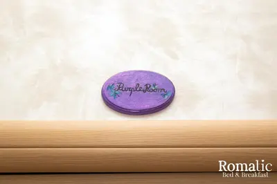a purple button with the words reproductive dysfunction on it at Romatic in Rome