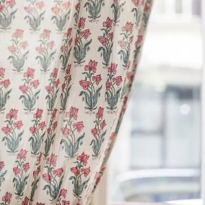 a curtain with a floral pattern on it at San Pietro Garden House in Rome