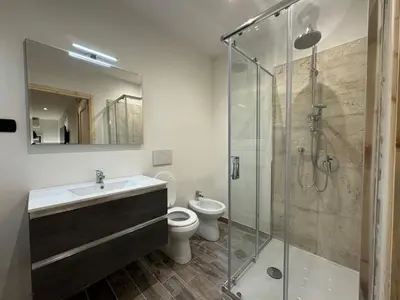 a bathroom with a sink and a toilet and a shower at Il Pontefice Luxury in Rome