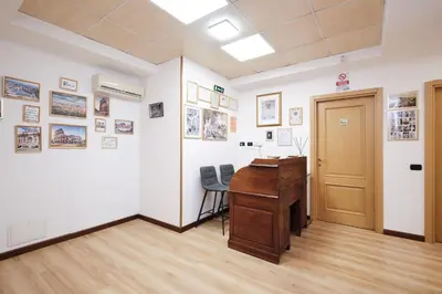 an office with a wooden desk in a room at Il Pontefice Luxury in Rome