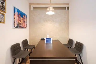a conference room with a wooden table and chairs at Il Pontefice Luxury in Rome