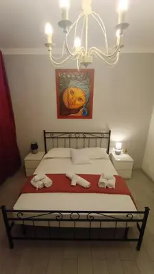 a bedroom with a bed with two towels on it at Casilina One in Rome