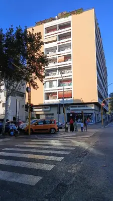an orange car is parked in front of a building at Casilina One in Rome