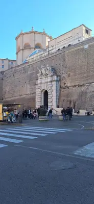 a large stone building with a gate in a street at Panorama suites & flats in Rome