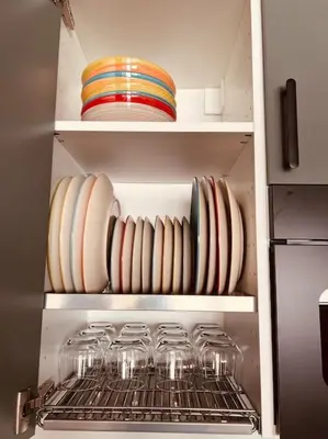 a kitchen with glasses and plates on shelves at Luxury apartment Balduina - Casa di Irene in Rome