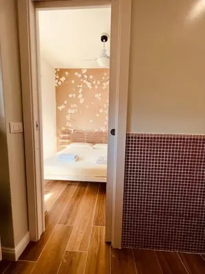 a room with a bedroom with a bed in it at Luxury apartment Balduina - Casa di Irene in Rome