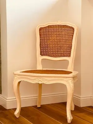 a white chair sitting in a corner of a room at Luxury apartment Balduina - Casa di Irene in Rome