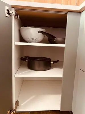 a white cabinet with a bowl and a pan on it at Luxury apartment Balduina - Casa di Irene in Rome