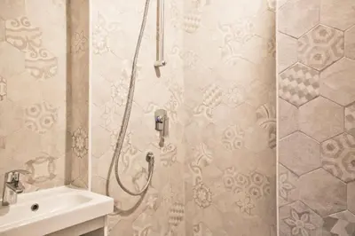 a bathroom with a shower and a sink at Casa Particular Vintage in Rome