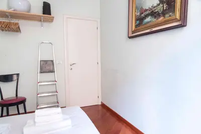a room with a ladder and a painting on the wall at Here's a new Laura's place - close to San Pietro in Rome