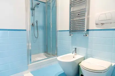a bathroom with a shower and a toilet and a sink at Here's a new Laura's place - close to San Pietro in Rome