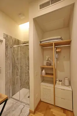 a shower room with a glass shower stall at Dea Rome Suites in Rome