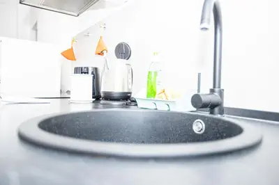 a bathroom counter with a sink with aaucet at Emily a Roma home in Rome