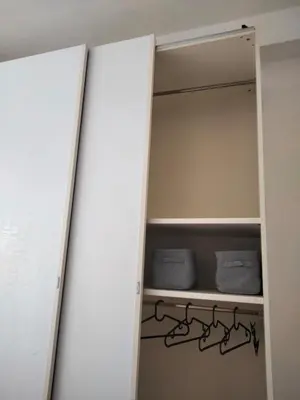 a closet with a door open and some towels at RIPOLI APARTMENT in Rome