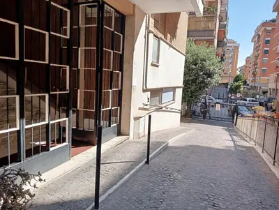 a street with a sign on the side of a building at RIPOLI APARTMENT in Rome