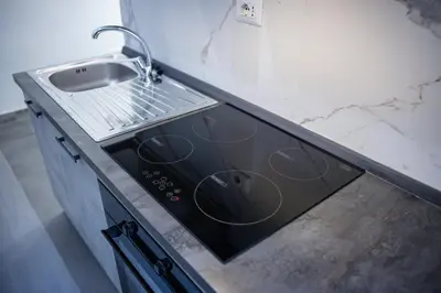 a kitchen with a sink and a stove at Casa Prefetti 46 B in Rome