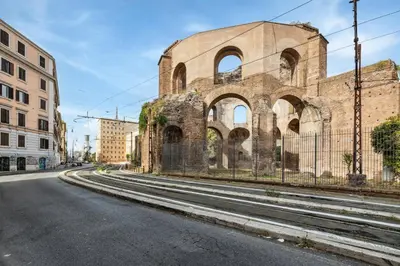 an old building on the side of a street at Limehome Rome via dei Reti in Rome