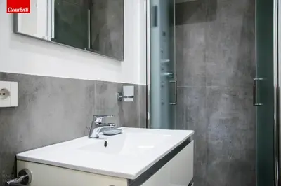 a bathroom with a sink and a shower at GuestHost - Largo Leopardi Modern Apartment in Rome