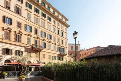 a group of buildings in a city with a street at GuestHost - Largo Leopardi Modern Apartment in Rome