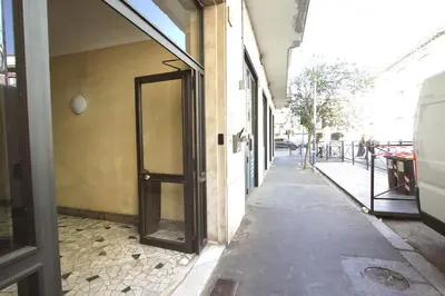 an empty hallway with a door to a building at Piramide Holiday House in Rome