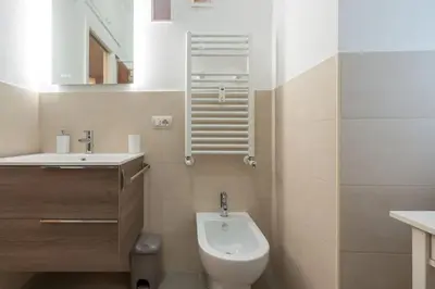 a small bathroom with a toilet and a sink at Vaticano vicino metro A-Comfort ed eleganza in Rome