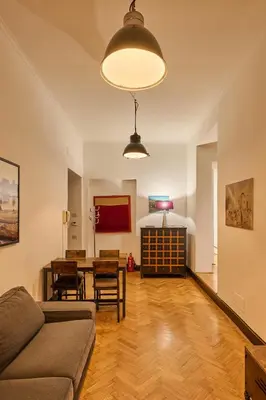 a living room with a couch and a table at Vittorio Apartment Rome in Rome