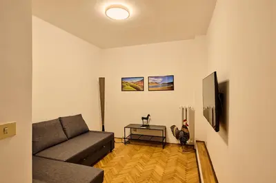 a living room with a couch and a table at Vittorio Apartment Rome in Rome