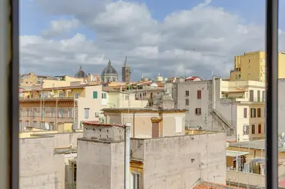 a view of a city from a window at LOFT CAPOCCI 37 - Home and More in Rome