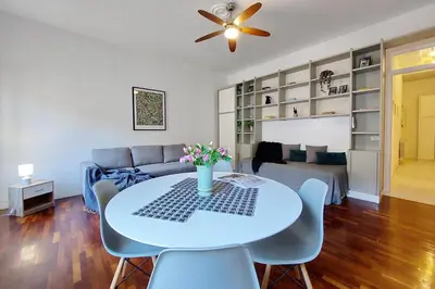 a living room with a table and chairs and a couch at Cozy Navona Flat in Rome