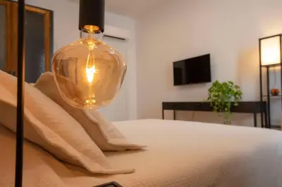 a bedroom with a bed with a lamp on it at Effe 9 Apartment - p.le Flaminio in Rome