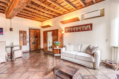 a living room with a couch and a table at Flat with Lovely Views near Piazza Navona in Rome
