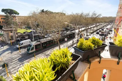 a view of a city street with a train at Cozy apartment Gianicolense 3bdr in Rome