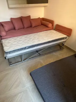 a large bed in a room with a couch at Sant'Angelo House in Rome