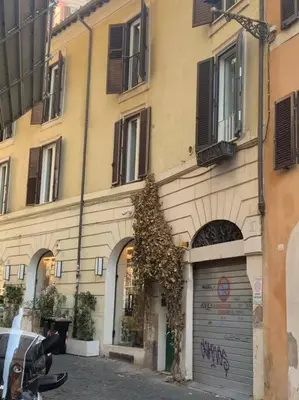 a building with a garage in front of it at Casa Claudia ~ rione Monti-Colosseo in Rome