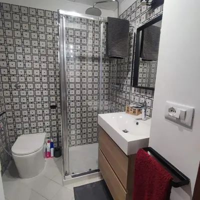 a bathroom with a shower and a toilet and a sink at Casa Claudia ~ rione Monti-Colosseo in Rome