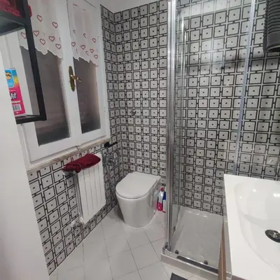 a bathroom with a toilet and a sink at Casa Claudia ~ rione Monti-Colosseo in Rome