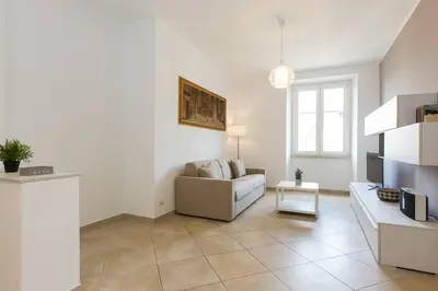 a living room with a couch and a table at Taurasia By Rental in Rome in Rome