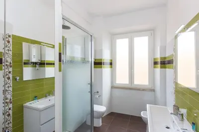 a bathroom with a toilet and a sink and a shower at Taurasia By Rental in Rome in Rome