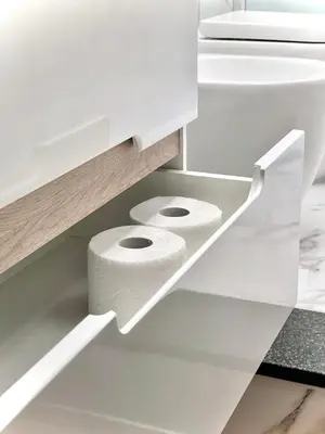 a white bathroom with toilet paper in a drawer at Avocado House - Cozy Apartment in the Heart of Rome in Rome