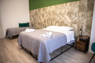 a bedroom with a white bed and a window at Vatican Fashion Home in Rome