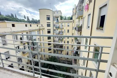 a view from a balcony of buildings at 4BNB - Cimabue Apartment in Rome
