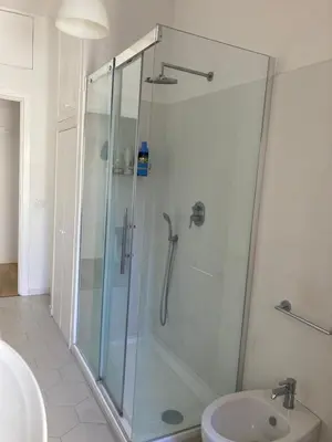 a bathroom with a shower and a toilet and a sink at Casa Caravella in Rome