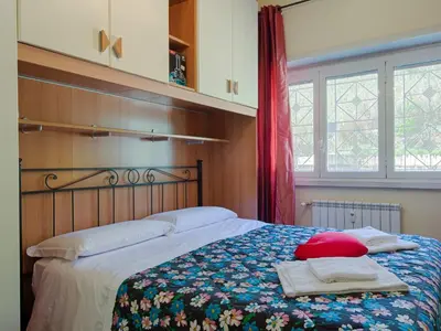 a bedroom with a bed with towels on it at Apartment Vaticanum Hills by Interhome in Rome