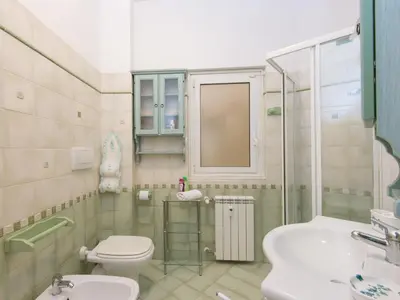 a small bathroom with a toilet and a sink at Apartment Vaticanum Hills by Interhome in Rome