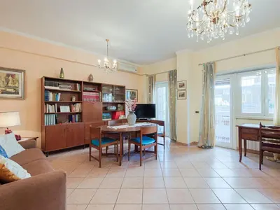 a living room with a table and a dining room at Apartment Vaticanum Hills by Interhome in Rome